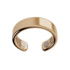 El Anillo de Magnoterapia - Alivio para la menopausia, en color dorado, presenta un diseño abierto y pulido con dos pequeños círculos metálicos en los extremos internos, expuesto sobre fondo blanco.